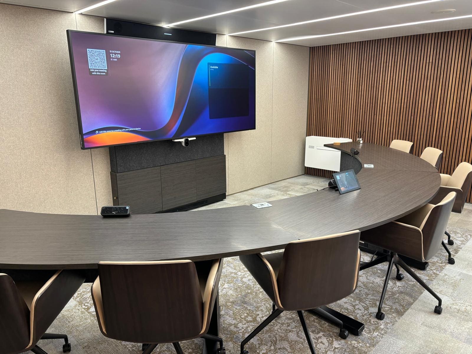 conference room with a flat screen tv on the wall