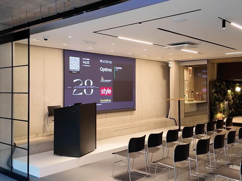 conference room with a projection screen and chairs