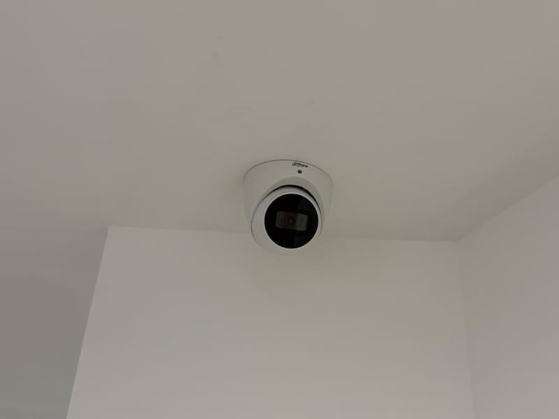 camera mounted to the ceiling of a room