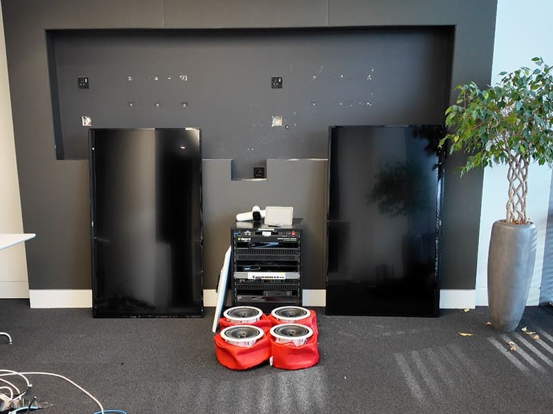 room with a stove and some speakers