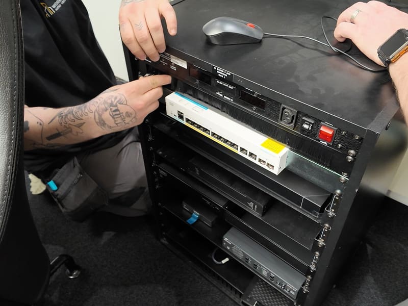 man working on a computer with a mouse