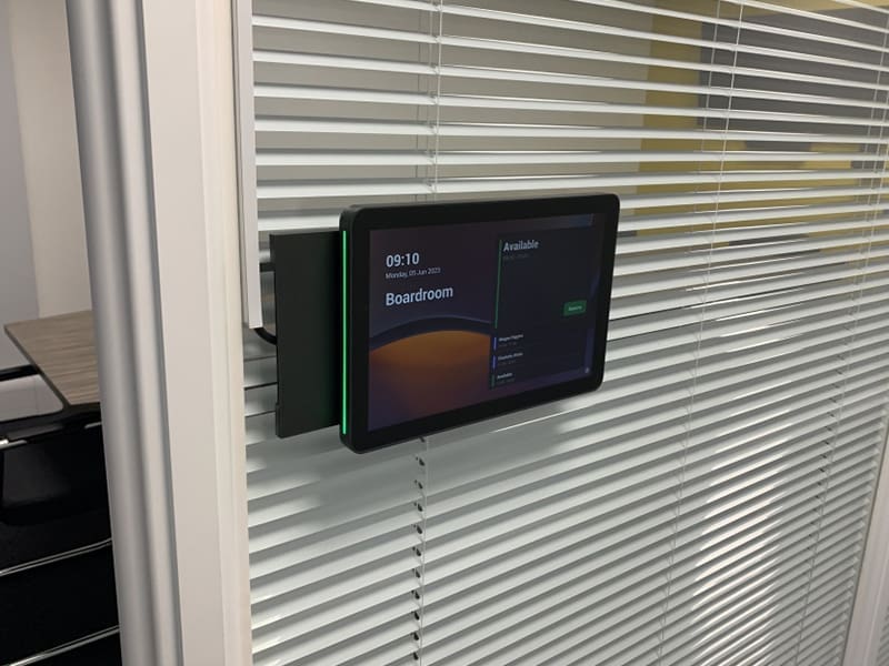 clock mounted to the side of a window