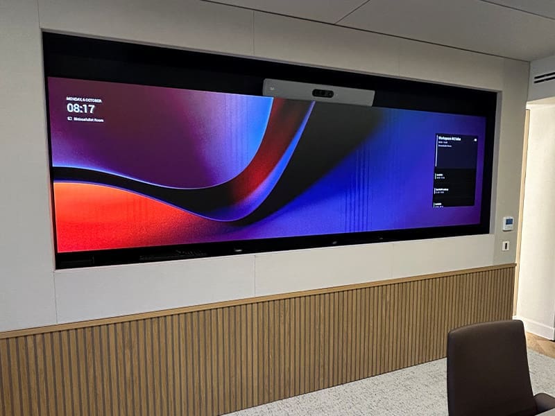 large flat screen tv mounted to the side of a wall