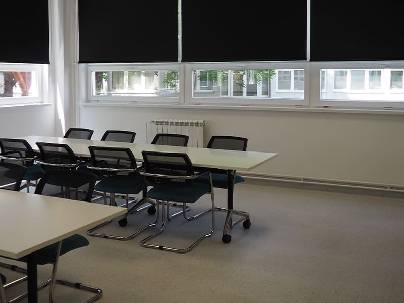 classroom with a long table and chairs