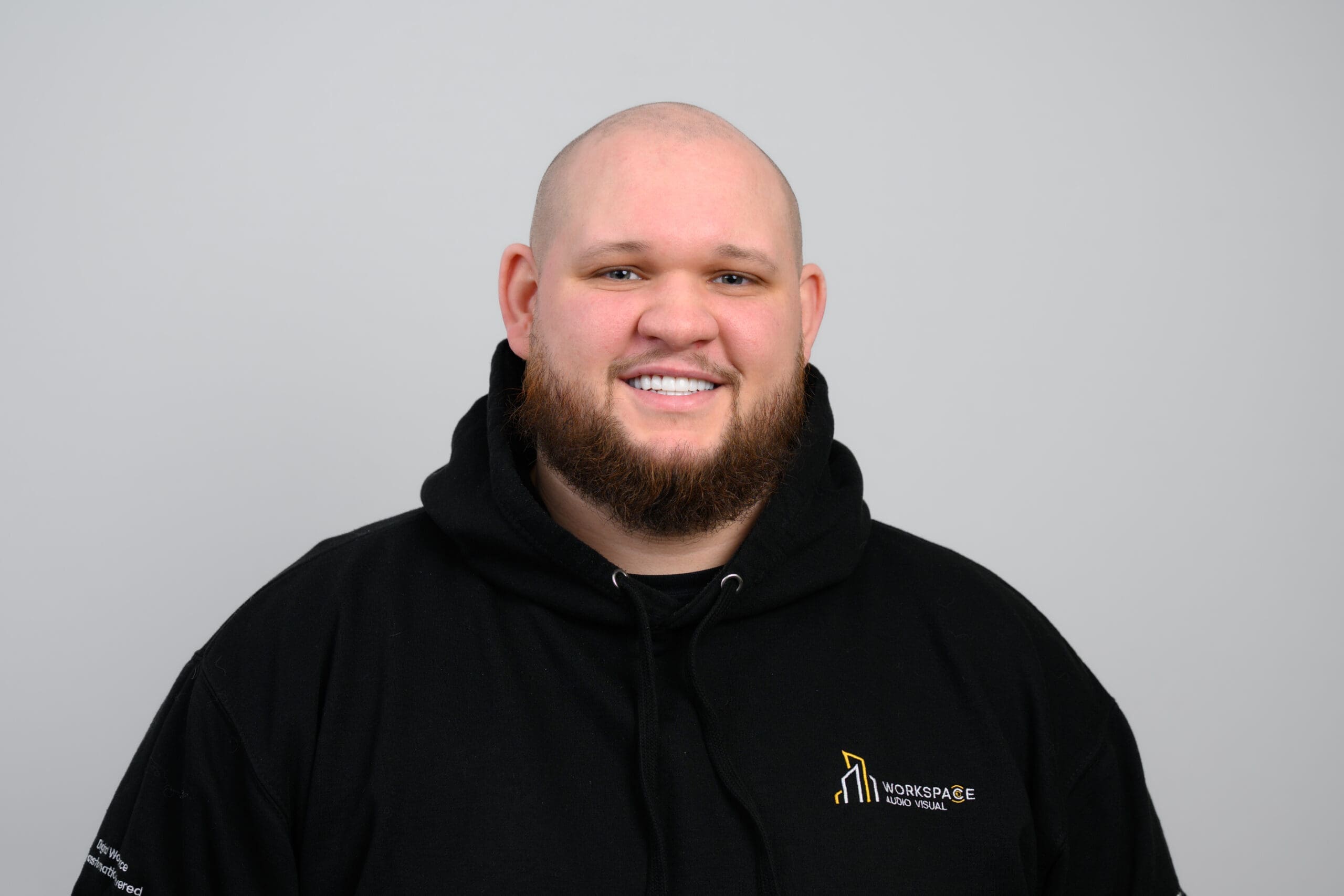 man with a beard wearing a black jacket