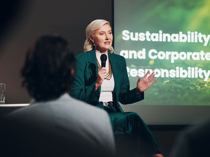 woman giving a presentation to a group of people