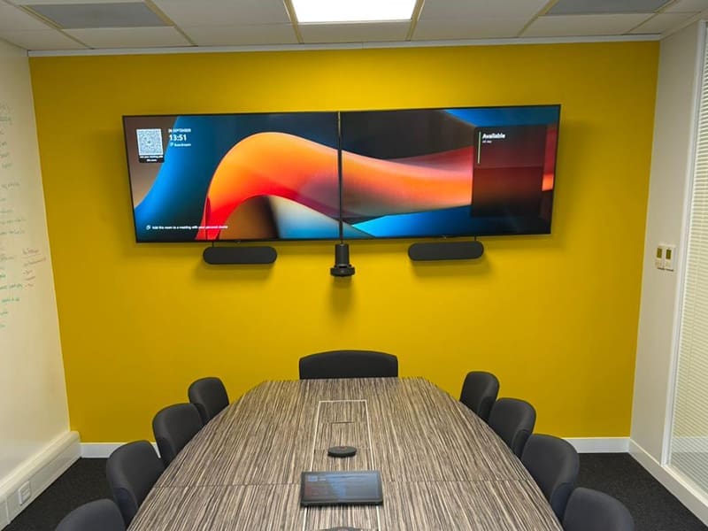 conference room with a large flat screen tv on the wall