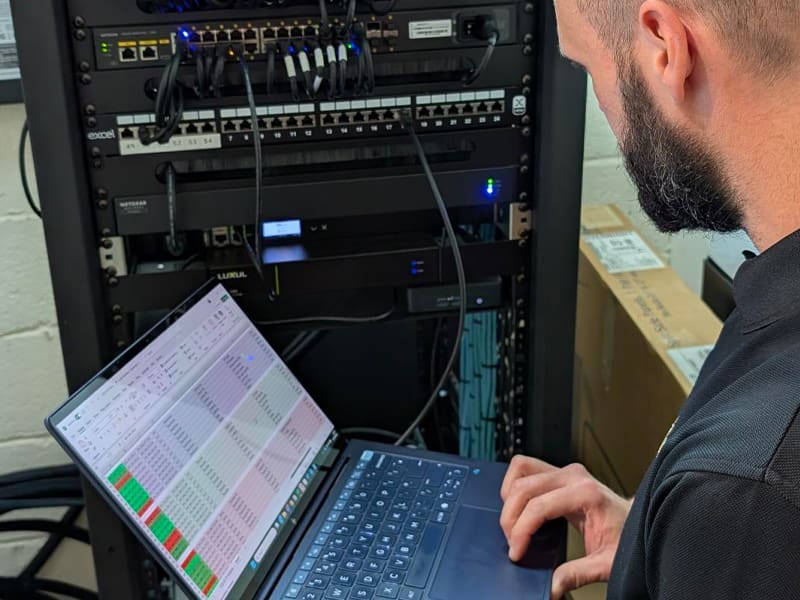 man sitting in front of a laptop computer