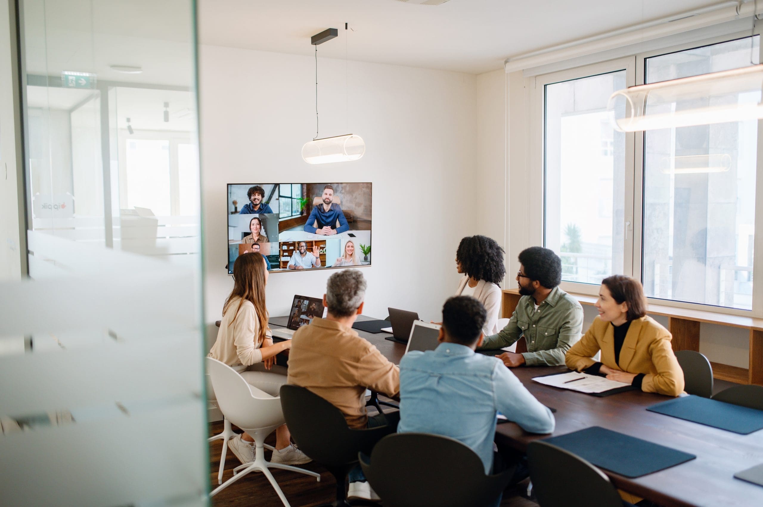 group of people sitting around a conference table